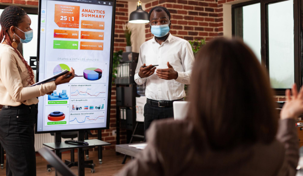 African American Entrepreneurs Showing Management Presentation Explaining Business Graphs Working Company Partnership Startup Office Businessteam With Medical Face Mask Against Covid19 1